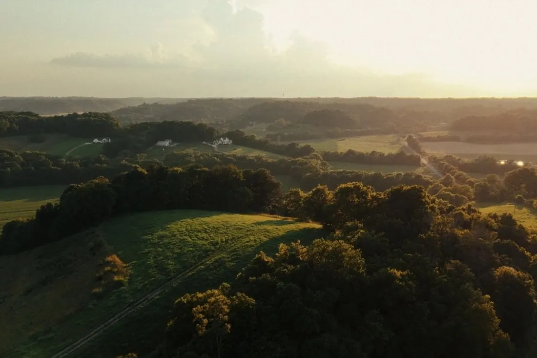 Golden-hour drone view over the Highlands at Carters Creek land